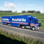 The famous red-and-blue colour schemed Pickfords truck on the road.