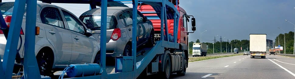 Moving vehicles by car carrier offered by Pickfords Removals.